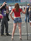 PHOTOGRAPHERS AND GRID GIRLS AWAIT THE CARS